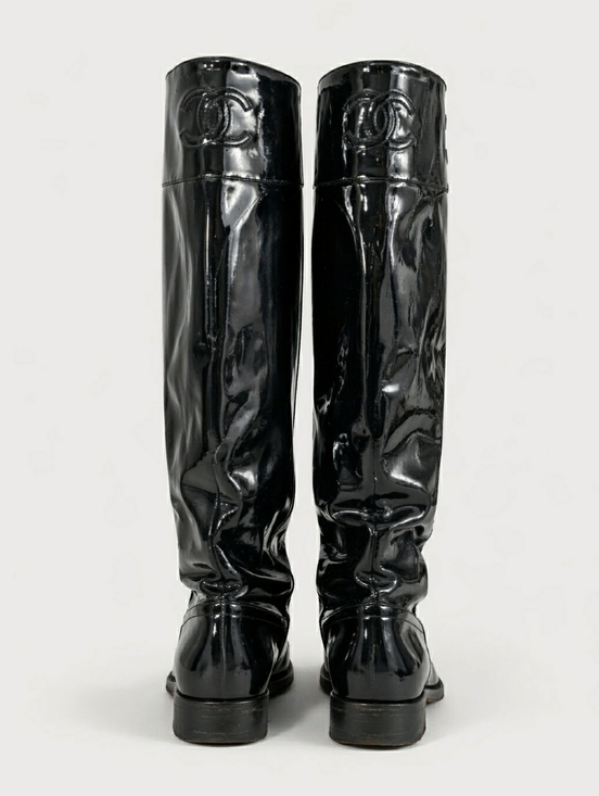 CHANEL Shoes - Chanel Patent Leather Knee-High Boots with Embossed Logo